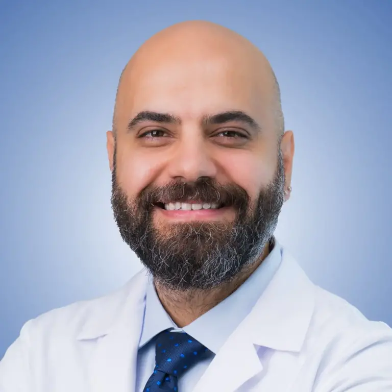Smiling clinician in a white coat shown on the Uroaesthetic Bookimed clinic profile