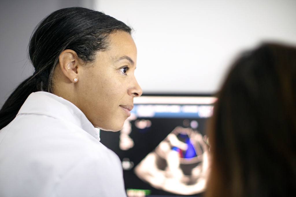 Joanna Chikwe discussing heart imaging with a colleague