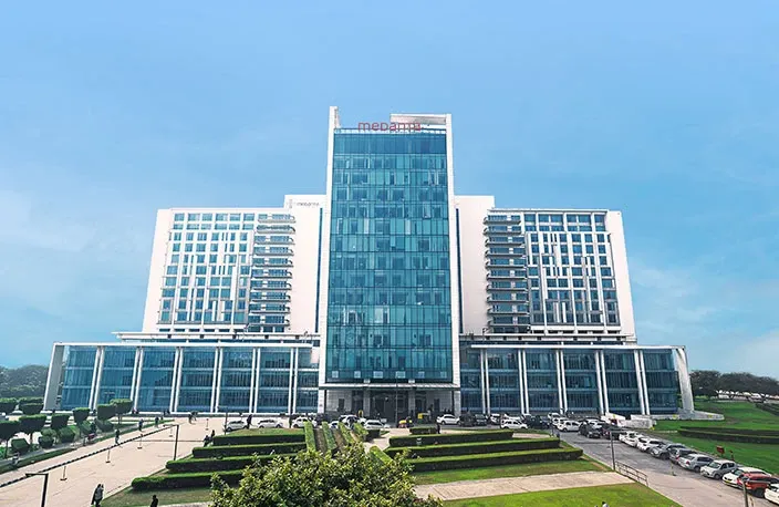 Medanta hospital building and landscaped grounds in Gurugram.