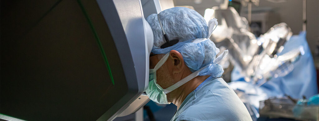 Husam Balkhy operating with a surgical robot at UChicago Medicine